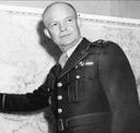 A photo of General Eisenhower planning in front of a map